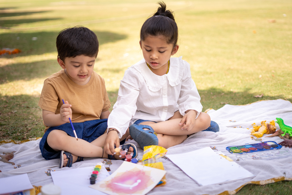Kids Painting Together in the Park